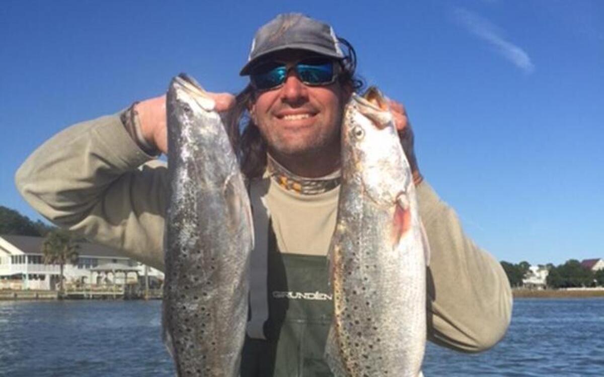 Peter Gerace shows off two spotted seatrout in the 6-pound range during the John Payne Memorial Hooks For Hearts Tournament in Murrells Inlet.