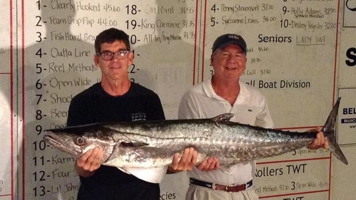 Gaston and Tolly Hughes of Wilmington, N.C., of Team Grip Flip show off the second-place king mackerel in the 2017 Fall Brawl King Classic.