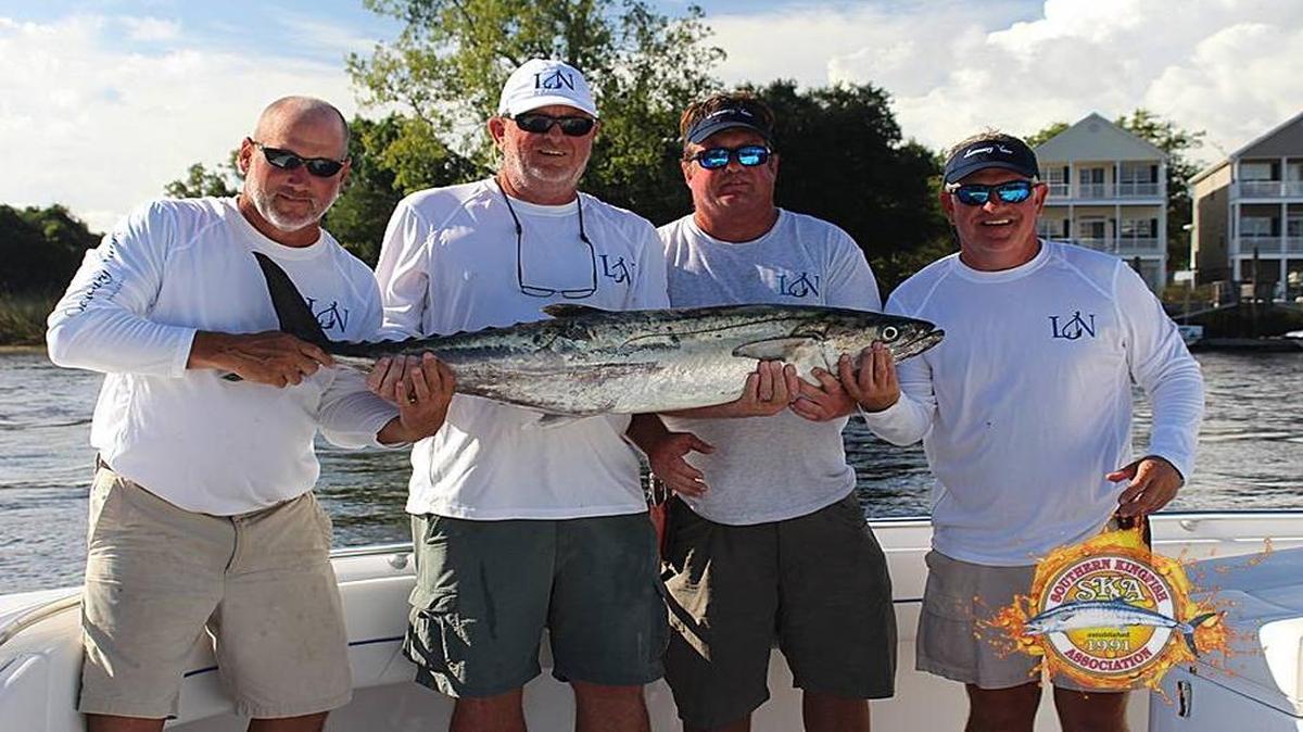 The crew of Low Country Native shows off the winning king mackerel, a 31.54-pounder, in the Rumble in the Jungle King Mackerel Tournament out of Harbourgate Marina in Little River on Sunday. From left are Joey Essary, Billy Powell, Jason Hogg and Keith Powell.