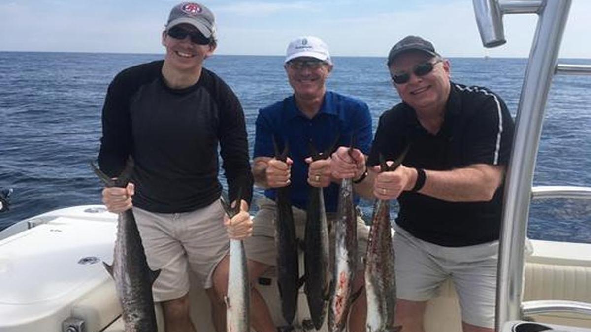 Anglers aboard the World Cat out of Ocean Isle Fishing Center show off king mackerel caught on a trip Tuesday.