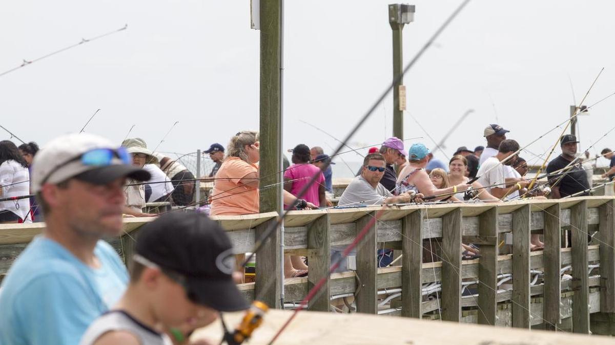 Hundreds of fishermen lined the rails of the Apache Pier last August for a day of fishing.