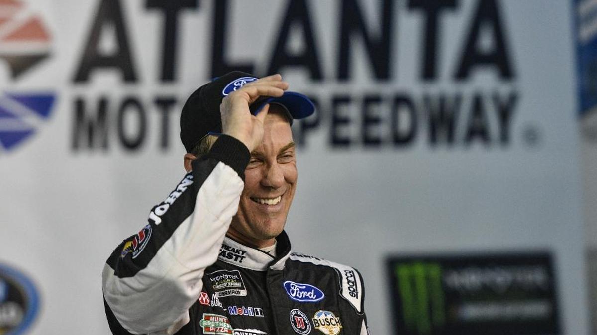 Kevin Harvick stands in Victory Lane after winning the pole for Sunday’s race.