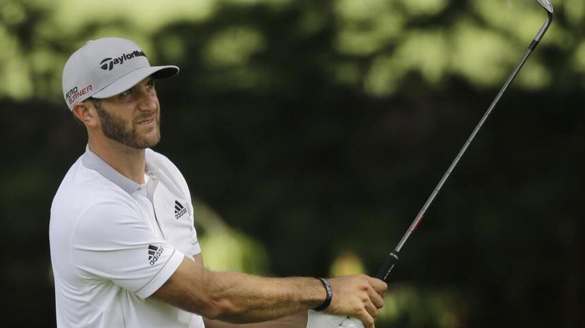 
Dustin Johnson hits from the rough on the first hole during the third round of the Bridgestone Invitational golf tournament at Firestone Country Club. The CCU alumnus returns to Whistling Straits this week looking for redemption and his first major title. 
