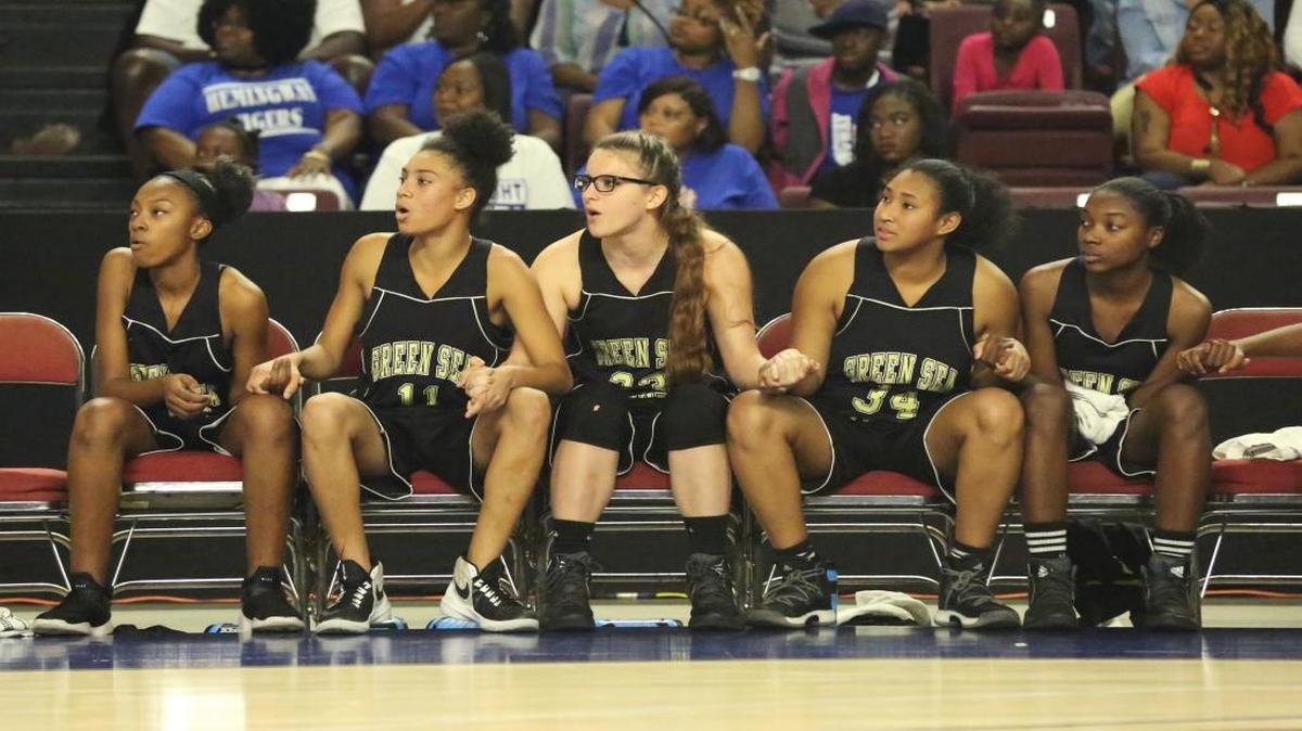 Green Sea Floyds players watch from the bench during Saturday’s Class A Lower State final.