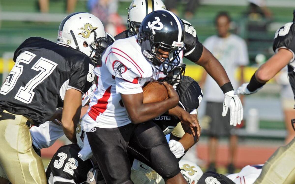 
Waccamaw running back Kevin Gasque runs against Socastee during their scrimmage at the CNB Kickoff Classic. Socastee defeated Waccamaw 13-0. Week 0 of high school football season kicks off this week, bringing with it several changes to the look of The Sun News’ print edition from past years. 
