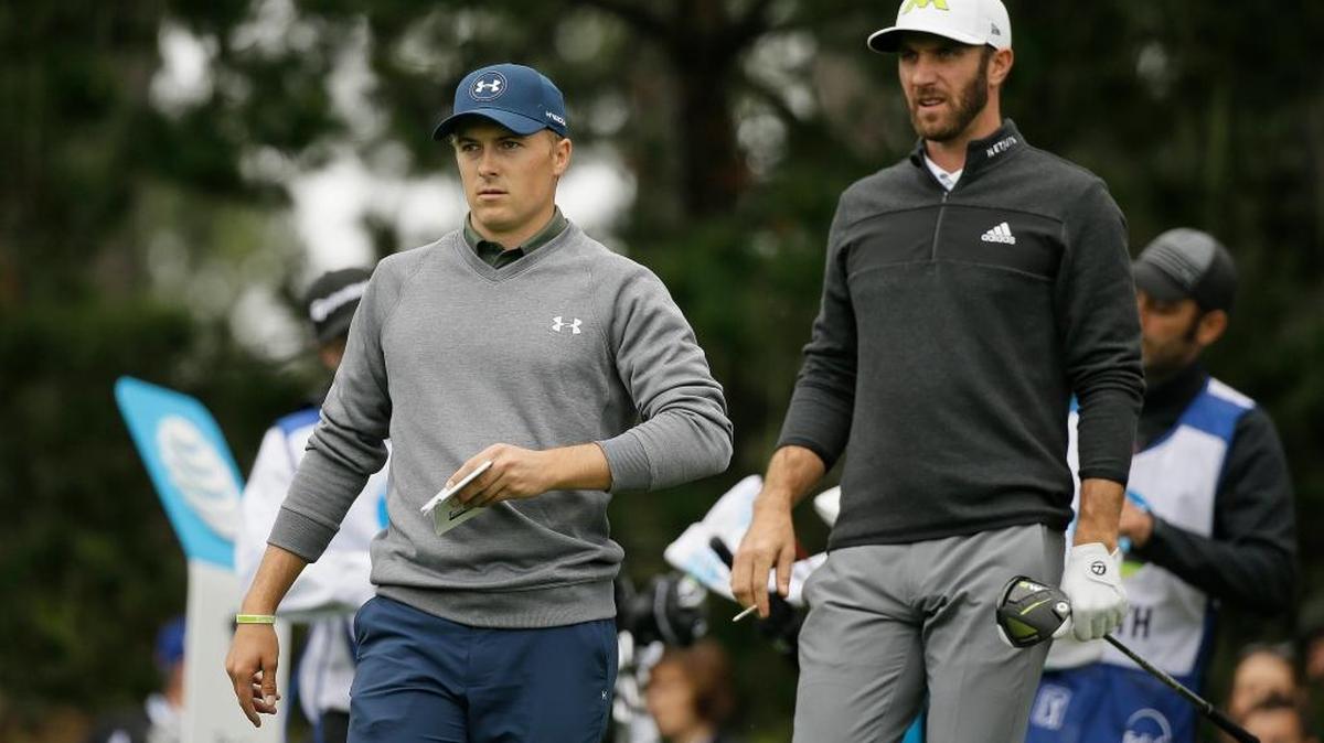 Jordan Spieth, left, and Dustin Johnson, right, make their way down the 11th fairway of the Spyglass Hill Golf Course during the second round of the AT&T Pebble Beach National Pro-Am.