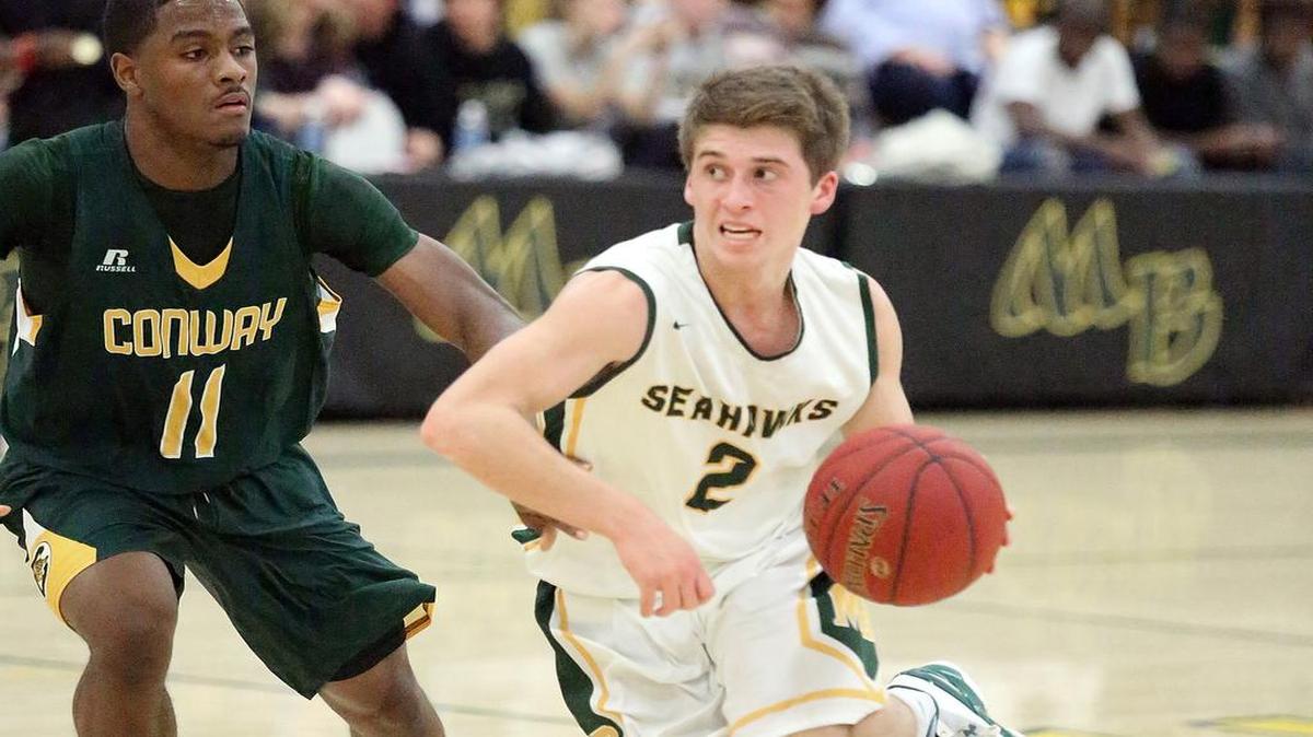 Myrtle Beach's Robert Swanson drives up the court in the game with Conway on Tuesday, Dec. 13, 2016.