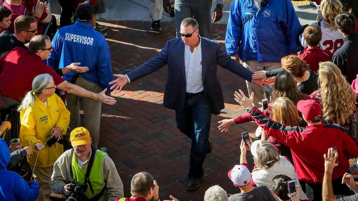 South Carolina interim head coach Shawn Elliott leads the players in the Gamecock Walk before the USC-Clemson game Saturday at Williams-Brice Stadium. 11/28/15