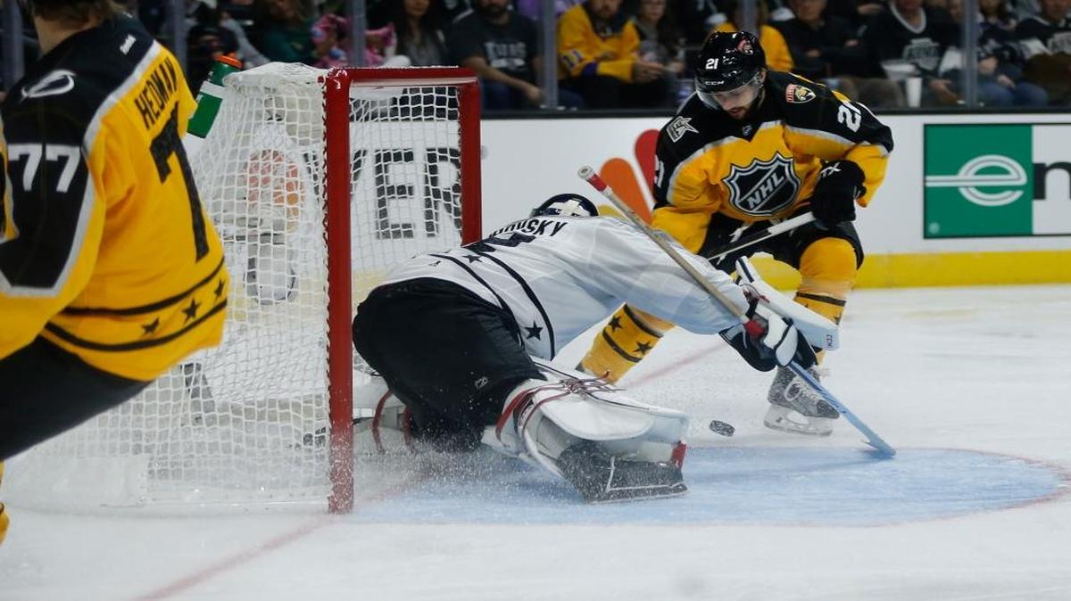 Atlantic division Buffalo Sabres forward Kyle Okposo (21) scores against Metropolitan division Columbus Blue Jackets goalie Sergei Bobrovsky (72) during the NHL All-Star game Sunday.