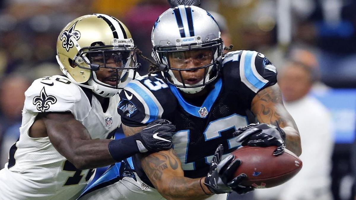 Carolina Panthers wide receiver Kelvin Benjamin (13) tries to pull in a pass as New Orleans Saints cornerback Ken Crawley (46) covers in the first half Sunday.